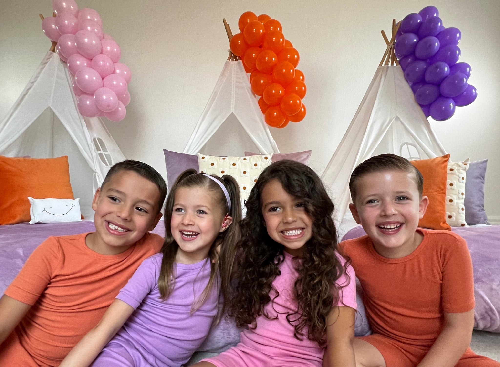 Kids smiling at a Little Bed Heads sleepover party